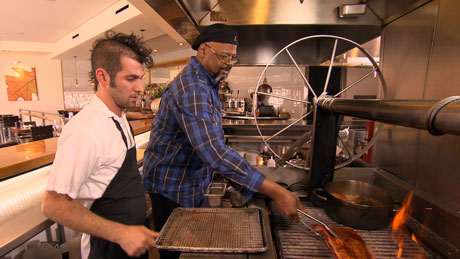 Michael grills short ribs over a wood fire at Oak at Fourteenth with Owner Steven Redzikowski